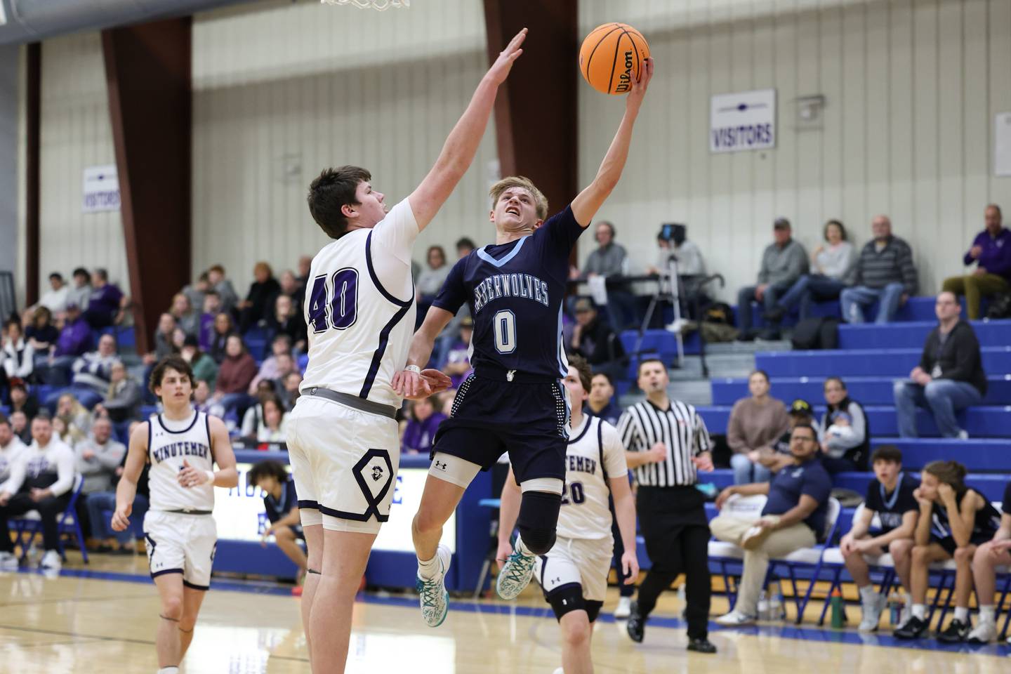 Cissna Park’s Seth Walder goes up for a layup against Lexington’s Cooper Meints during the Timberwolves' 50-45 loss to Lexington in the IHSA Class 1A Milford Regional semifinal on Wednesday, Feb. 26.