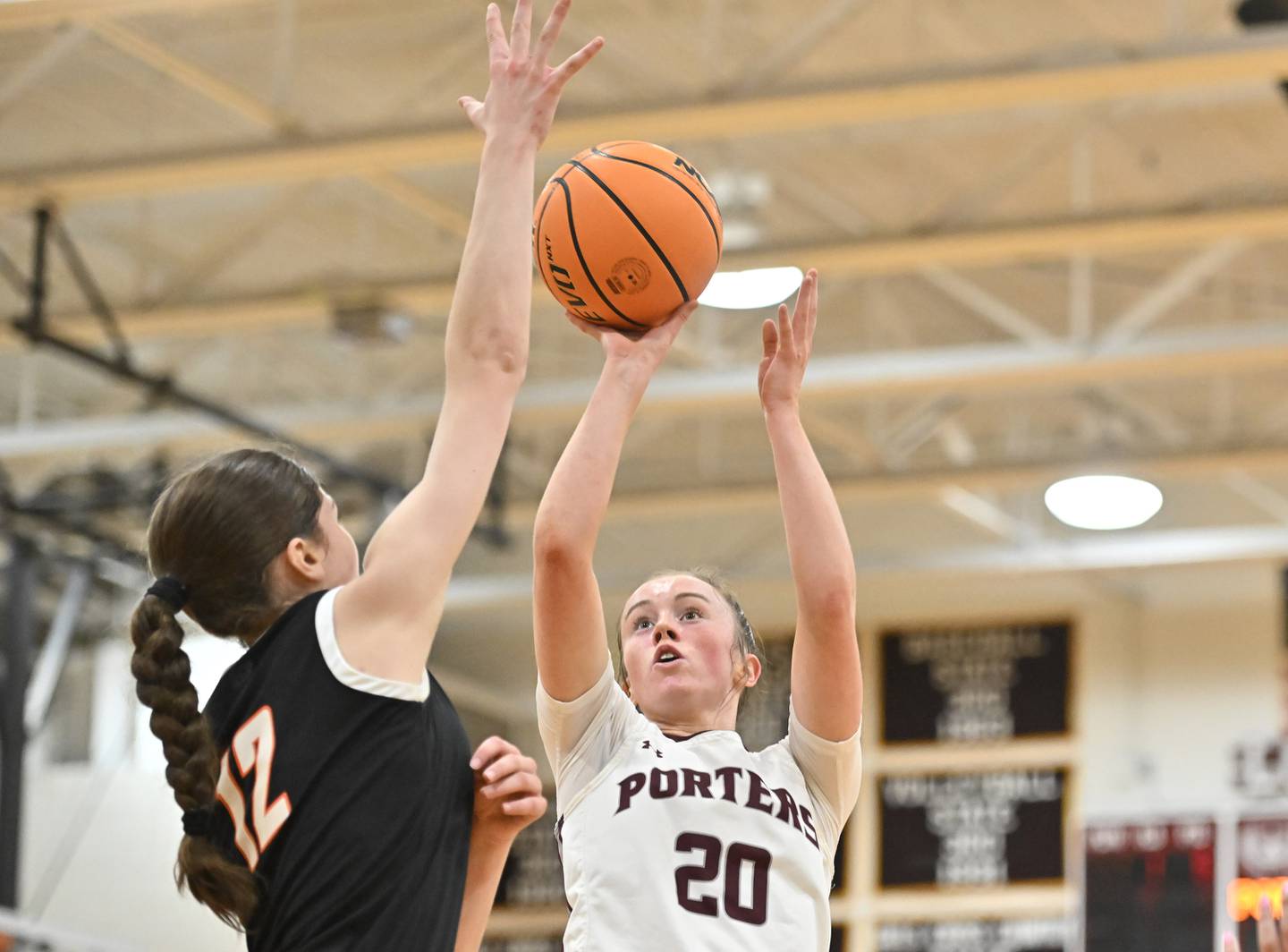 Lockport's Lucy Hynes (20) shoots a shot over Lincoln-Way West's Samantha Green (12) during a conference game on Tuesday, Feb. 04, 2025, at Lockport.