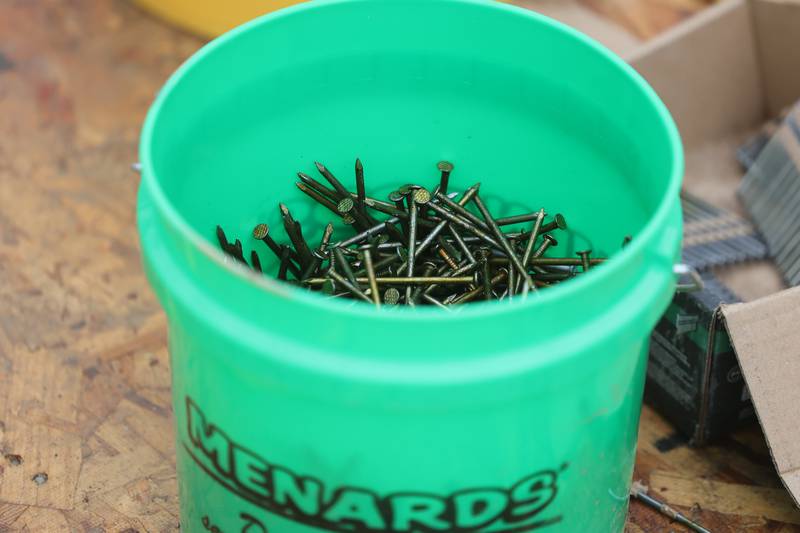 A bucket of nails sit on the job sight a home being built by Habitat for Humanity on Wednesday, Oct. 25, 2023 in Lockport.