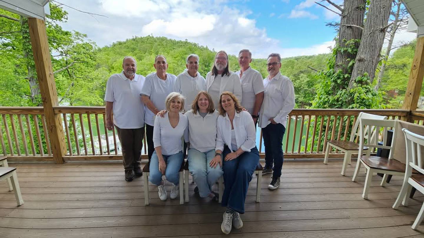John Clauson, stands far left, with his eight younger siblings who he met after nearly 80 years of believing he was an only child.