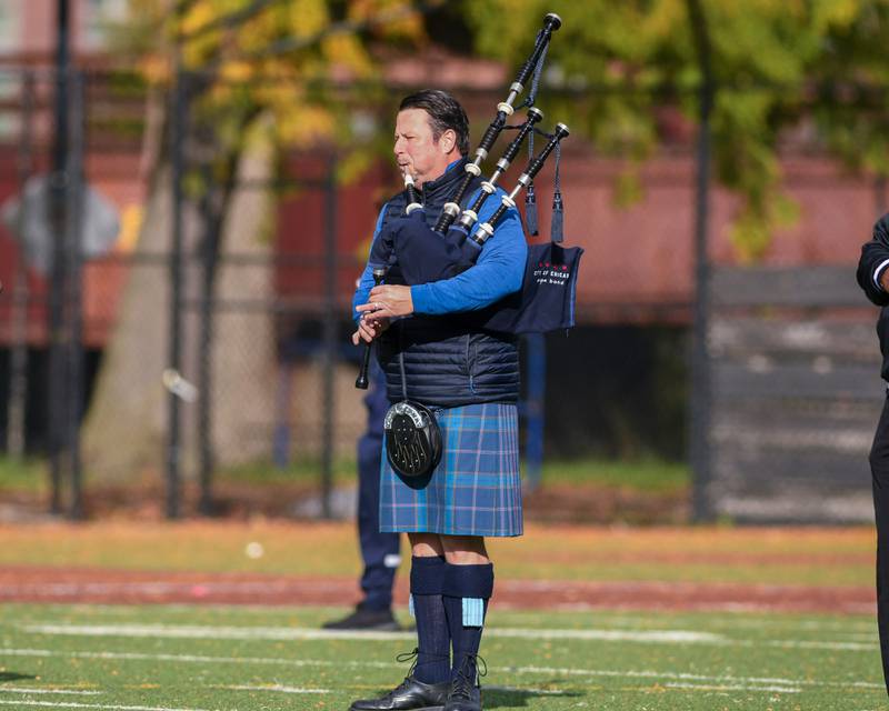 A bagpiper plays before the start of the Chicago Hope Academy and IC Catholic 3A playoff football game on Saturday Nov. 1, 2025, held at Altgeld Park in Chicago.