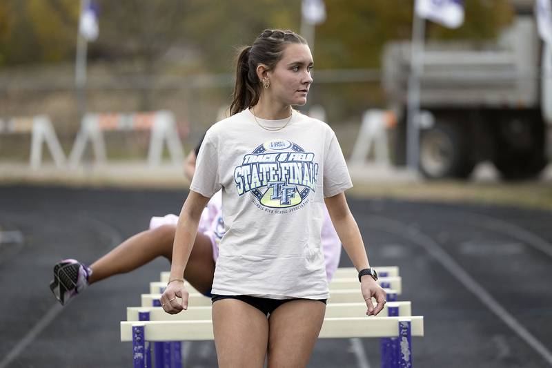 Dixon cross country runner Daniela Lovett warms up Thursday, Nov. 6, 2025. Lovett qualified for the state tournament this weekend.