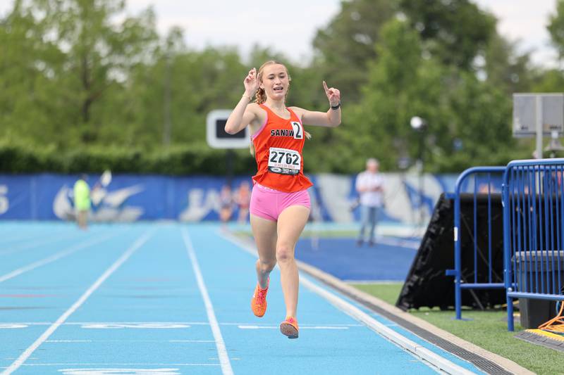 Sandwich’s Sunny Weber celebrates as she sets the new record  in the 1600 m run during the IHSA Class 2A Girls Track & Field State Finals on Saturday, May 24, 2025.
