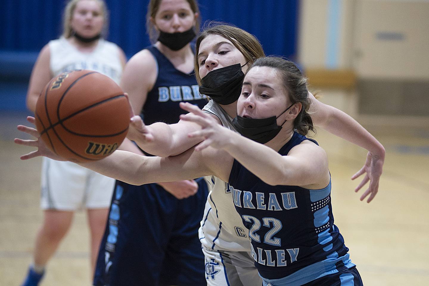 Newman's Adalyn Waldschmidt and Bureau Valley's Kaleen Carlson go for a loose ball on Wednesday, Jan. 19, 2022.