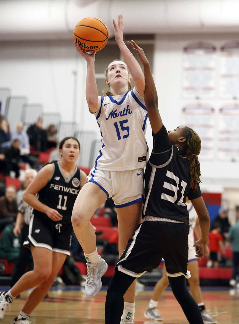 St. Charles North's Bronwyn How (15) shoots over Fenwick's Darryelle Smith (31) during the Dundee-Crown High School 41st Annual Komaromy Classic Friday, Dec. 27, 2024 in Carpentersville.