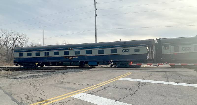 A CSX Geometry Train car enters the crossing along Mill Street on Tuesday, Dec. 17, 2024 in Utica. A geometry train inspects the track and checks for defects while reporting them to the engineer.