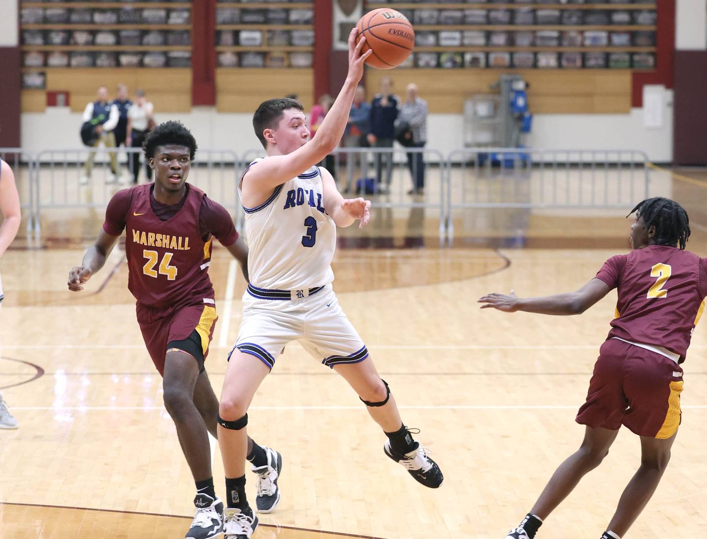 Hinckley-Big Rock's Ben Hintzsche kicks the ball out to a shooter in front of Chicago Marshall's Ja'Juan Cozark Wednesday, March 1, 2023, during their Class 1A sectional semifinal matchup at Elgin High School.