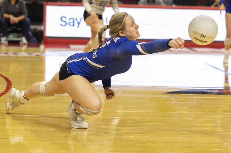 Newman’s Molly Olson reaches for a shot Friday, Nov. 11, 2022 in a class 1A volleyball semifinal against Aquin.