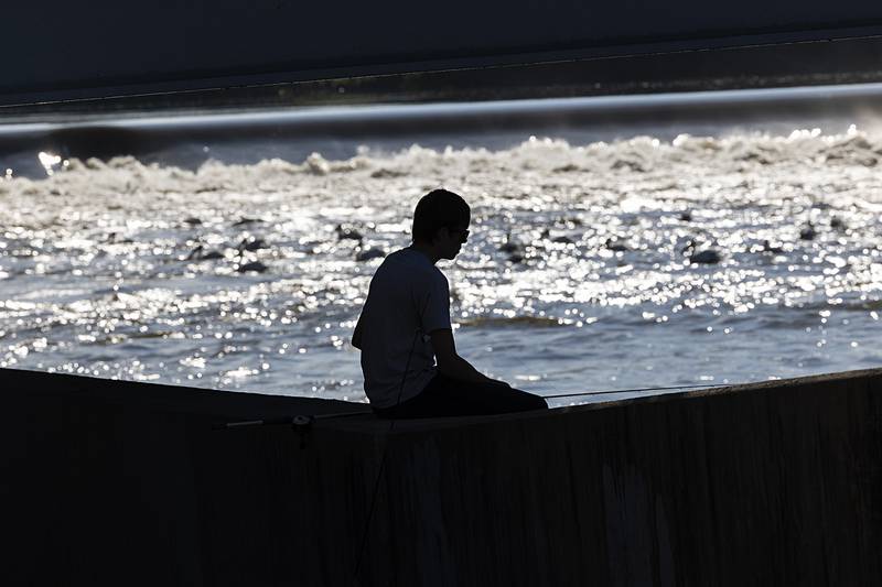 Talon Dale, 17, of Byron fishes under the Galena Avenue bridge Saturday, July 6, 2024 during the Petunia Fest fishing derby. The derby had 51 people signed up and one hour into the contest had already clocked in over 40 fish.