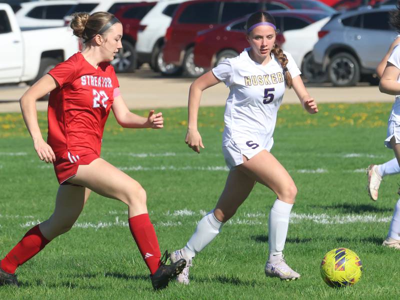 Streator's Elsa Sorensen moves the ball ahead of Serena/Newark/Earlville's Kiera McNeils on Thursday, April 16, 2026 at the James Street Recreational Complex in Streator.