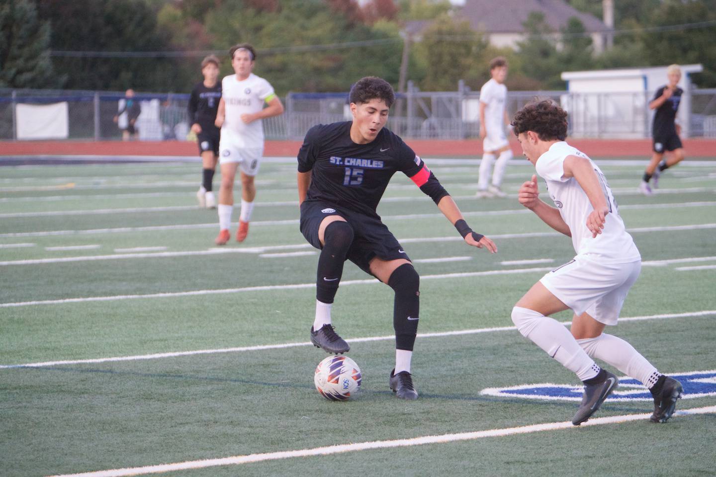 St. Charles North's Wicho DelaPaz looks for space to move against Geneva's Ben Raby on Tuesday, Sept. 9,2025 in St. Charles.