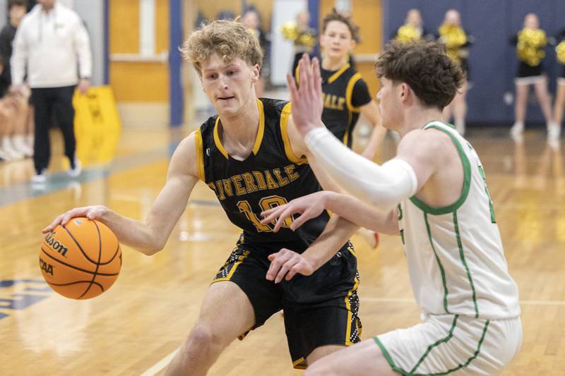 Riverdale’s Brody Clark handles the ball against Rock Falls’ Ryken Howard Friday, Feb. 28, 2025, during the Class 2A Regional final at Bureau Valley High School.