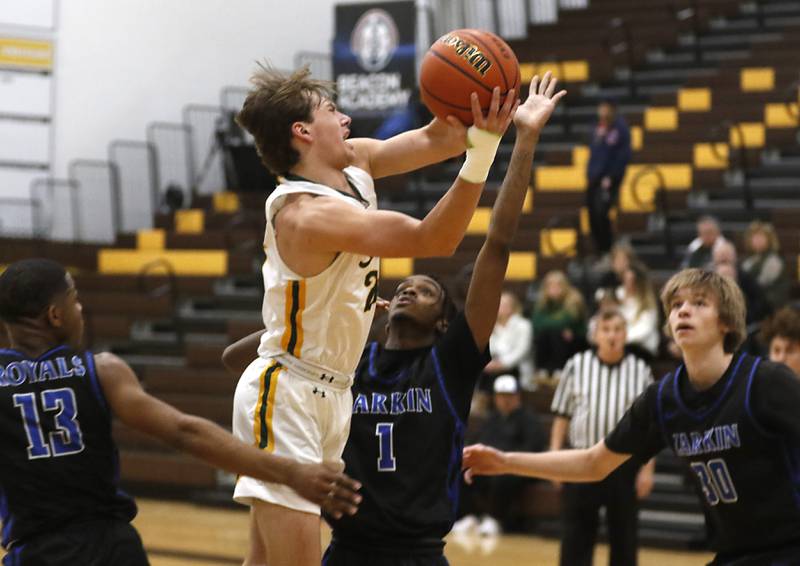 Crystal Lake South's Cooper LePage drives to the basket against Larkin’s Darnell Wilder, Joshua Hibbett, and Jack Casebeer during a Hinkle Holiday Classic basketball game Wednesday, Dec. 28, 2022, at Jacobs High School in Algonquin.