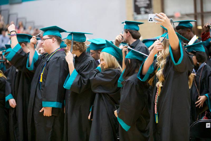 Graduates move the tassle officially graduating at Woodstock North's Graduation Ceremony on Saturday, May 13, 2023 in Woodstock.