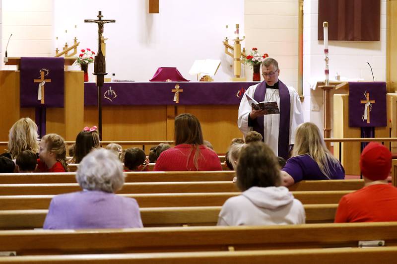 Rev. Mark Buetow, of the Zion Evangelical Lutheran Church in McHenry, delivers his sermon on Wednesday, Feb, 14, 2024, during a service for the students and church members on Ash Wednesday.