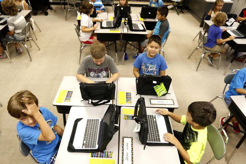 Lincoln Prairie Elementary School third grades power up their Chromebooks in Sue Hewitt's classroom on Aug. 16, 2016, in Lake in the Hills. Algonquin-based Community School District 300 is giving every first through eighth grade students Chromebooks.