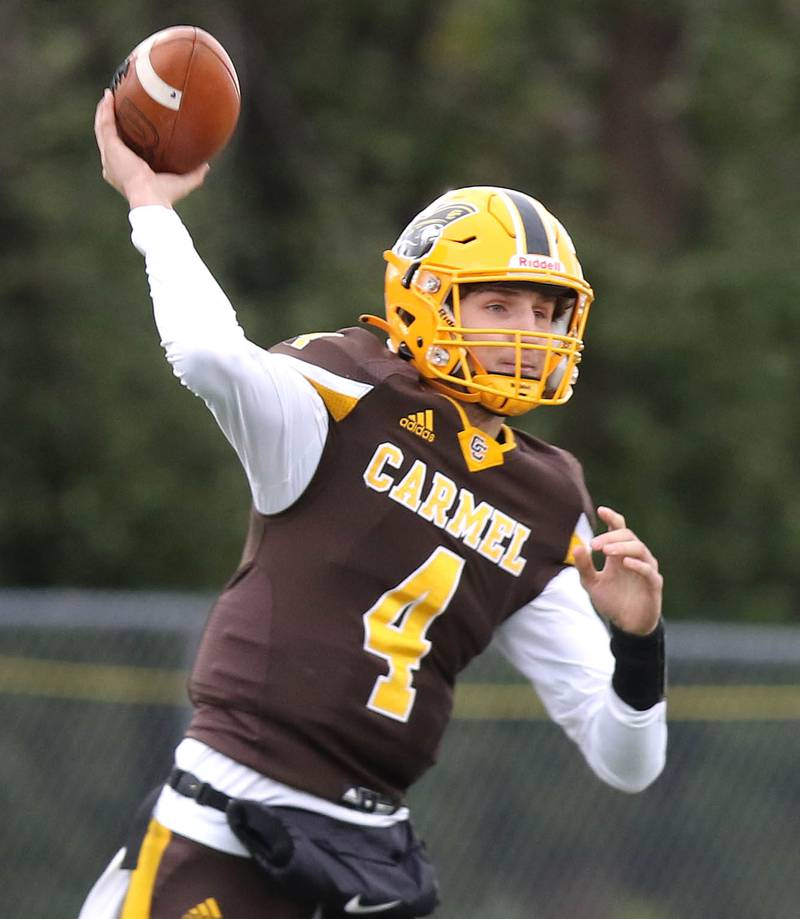 Carmel's Johnny Weber fires a pass during their Class 5A second round playoff game against Sycamore Saturday, Nov. 5, 2022, at Carmel Catholic High School in Mundelein.