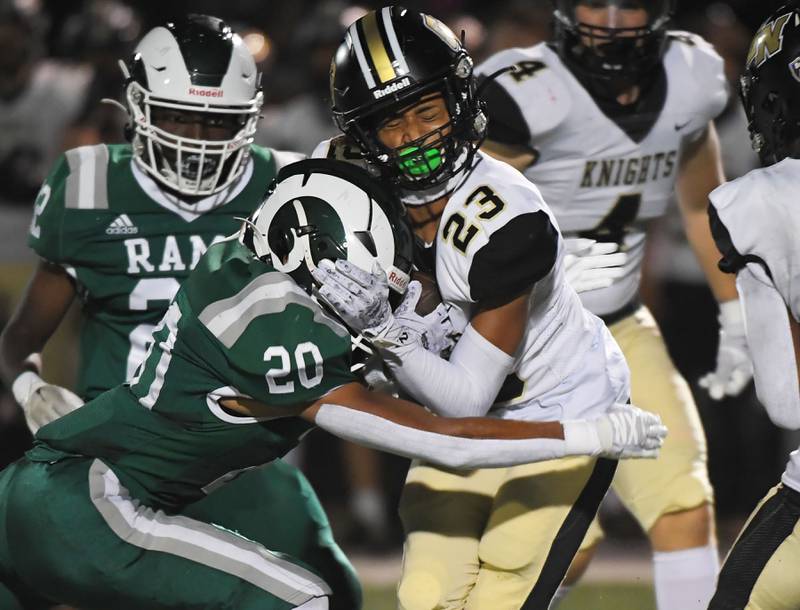 Grayslake Central’s Alex Carter crashes into Grayslake North’s Elijah Ayivi in a football game at Central High School on Thursday, September 14, 2023.