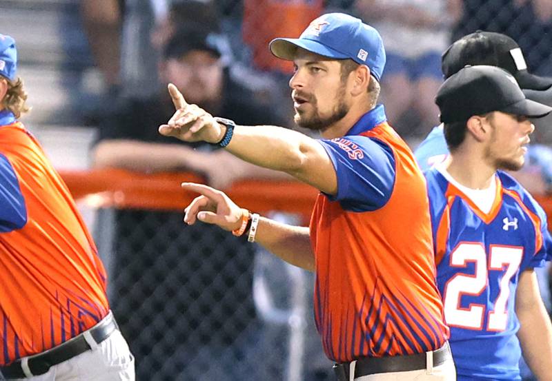 Genoa-Kingston's head coach Cam Davekos yells instructions to his team during their game against North Boone Friday, Sept. 9, 2022, at Genoa-Kingston High School.