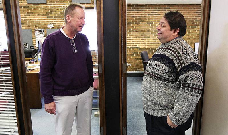 City administrator Dave Nelson (left) and newly appointed mayor Mike Kelly talk Wednesday, Nov. 9, 2016, after a morning meeting at City Hall. The Harvard City Council selected alderman Kelly to replace Mayor Jay Nolan who resigned from his post Tuesday after more than 11 years to start a distillery in town.