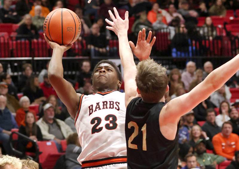 DeKalb’s Davon Grant looks to score over Sycamore's Ben Larry Friday, Jan. 26, 2024, during the FNBO Challenge in the Convocation Center at Northern Illinois University.