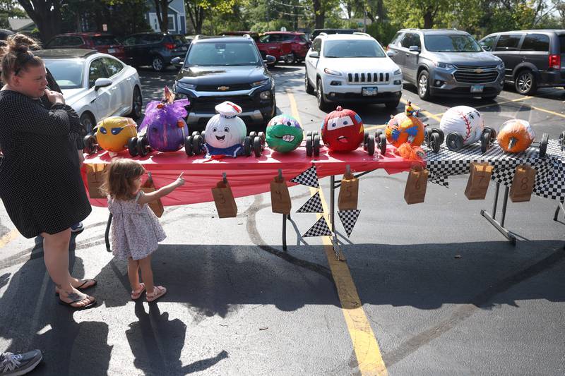 Pumpkin entries sit on display before the start of the Pumpkin Derby at the Wish Upon a Star fundraiser on Saturday, Oct. 5, 2024 in Joliet.