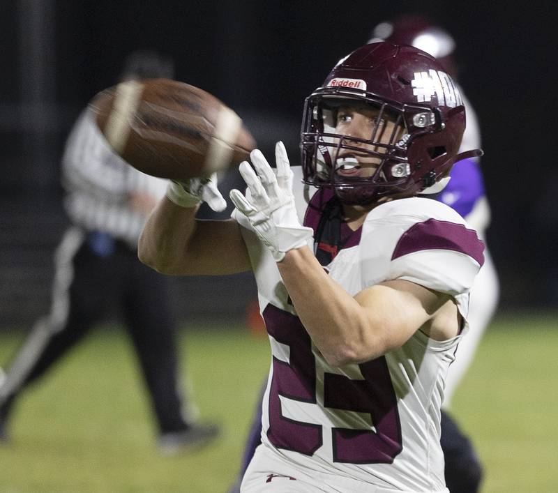 Marengo’s Hunter Muench hauls in a pass against Dixon Friday, Nov. 1, 2024 in the 4A football playoffs in Dixon.