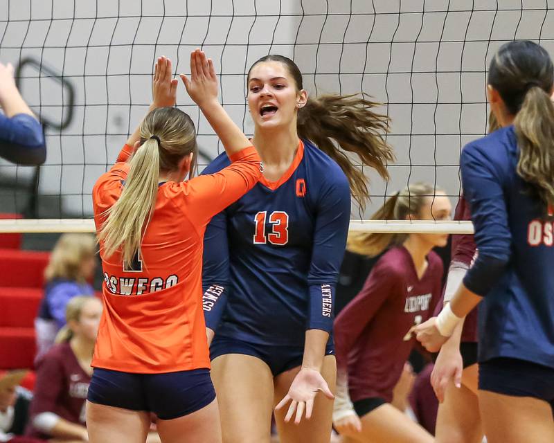 Oswego's Sidney Hamaker (13) celebrates a kill during Class 4A Bolingbrook Sectional final match between Lockport at Oswego.  Nov 7, 2024  in Bolingbrook.