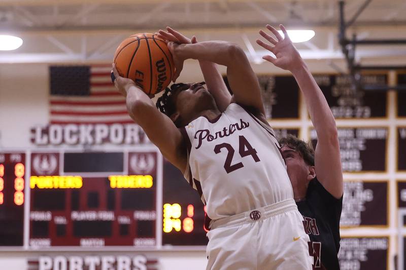 Lockport’s Izeyah Pruitt draws the foul taking a shot against Plainfield North on Friday, Jan. 3, 2025 in Lockport