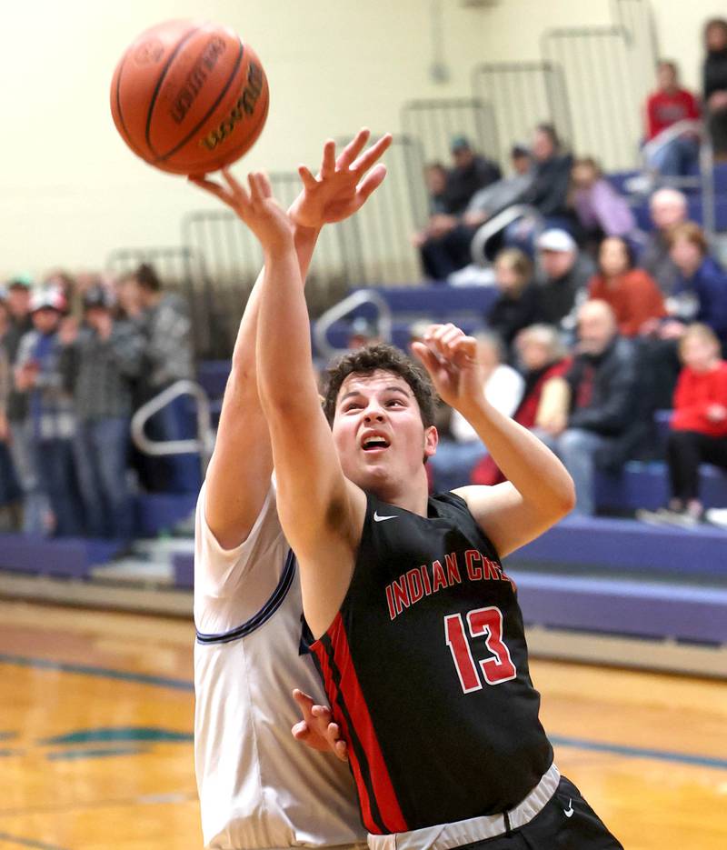 Indian Creek's Sam Genslinger gets up a shot in front of a Hinckley-Big Rock defender during their game Tuesday, Jan. 31, 2023, in the Little 10 Conference Basketball Tournament at Somonauk High School.