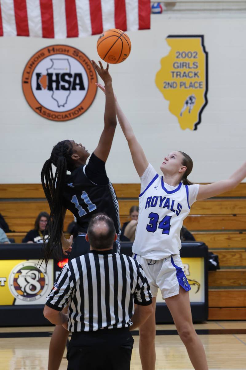 Kankakee's Shania Johnson, left, and Rosary's Grace Bergeron tip off during the Kays' 75-28 victory over Rosary at the Reed-Custer Classic on Monday, Nov. 17, 2025.