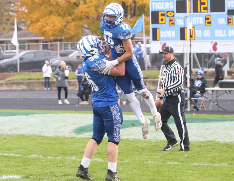 Princeton's Owen Hartman lifts up Kaydin Gibson after scoring the teams only touchdown against Montini Catholic during the Class 3A quarterfinal game on Saturday, Nov. 16, 2024 at Bryant Field in Princeton.