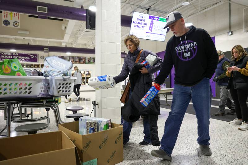 Attendees drop off donations for Harbor House as they arrive to Manteno and Bishop McNamara basketball game for Safe Harbor Night to benefit Harbor House on Tuesday, Jan. 13, 2026.