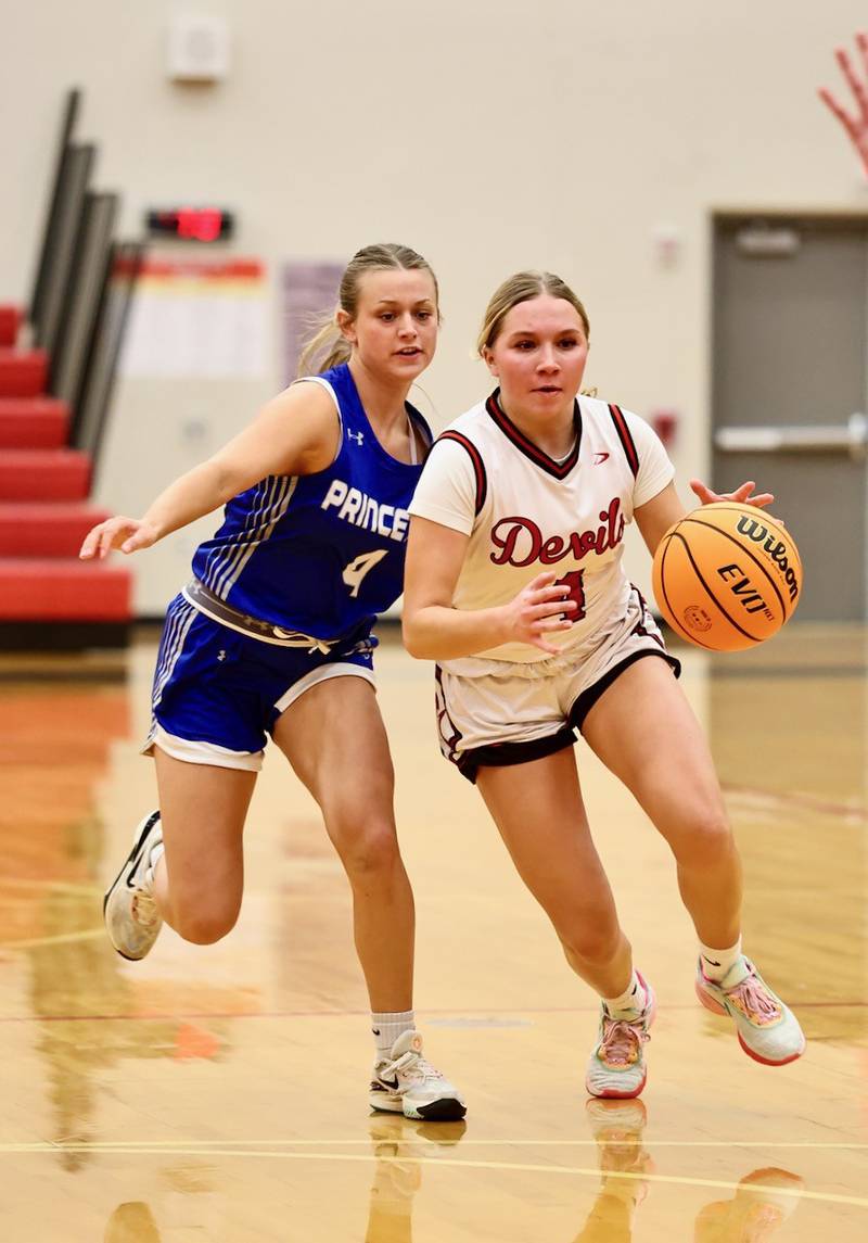 Hall's Charlie Pellegrini gets a step on Princeton's Madie Gibson Thursday night at Hall. The Tigresses won 48-28.