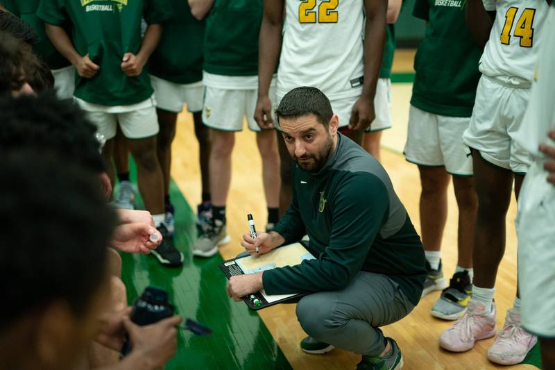 Waubonsie Valley's head coach Andrew Schweitzer talks to his team during a Waubonsie Valley 4A regional semifinal basketball game against Oswego at Waubonsie Valley High School in St.Charles on Wednesday, Feb 22, 2023.