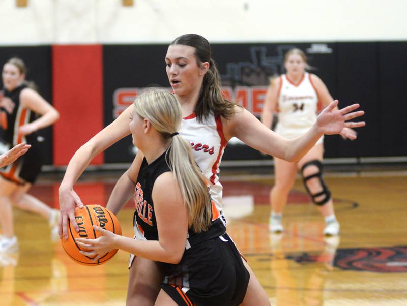 Fulton's Chloe Wilkin (22) gets a hand on the ball as she guards Milledgeville's Taylor Sarber (3) on Friday, Jan. 24, 2025 att Fulton High School.