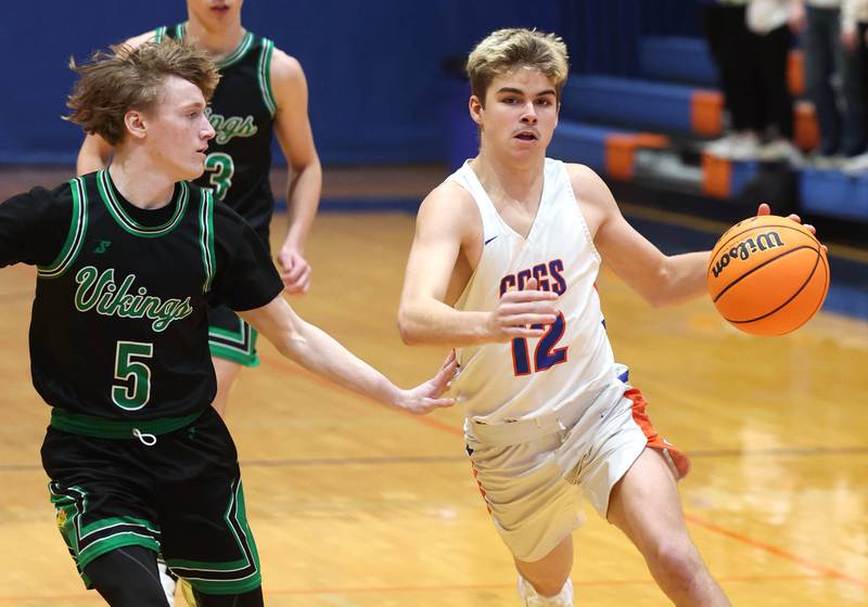 Genoa-Kingston's Blake Ides drives the lane against North Boone's Collin McKibben during their Class 2A regional game Monday, Feb. 24, 2025, at Genoa-Kingston High School.