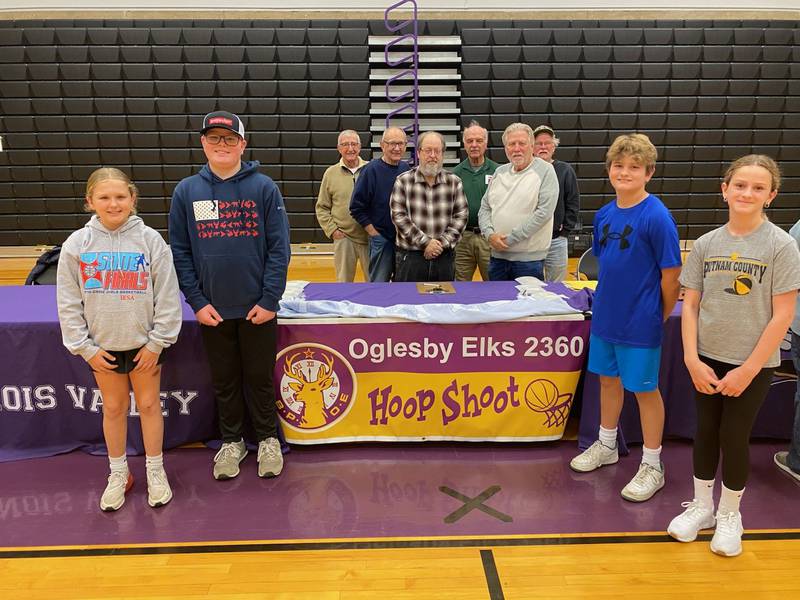 Reese Lenkaitis (from left), Marshall Holocker, Blake Richardson and Brynn Zimmerlein of pictured with members of the Oglesby Elks 2360 who hosted the Hoop shoot on Sunday, Dec. 15. Holocker advanced for the 10-11 year old boys and Lenkaitis placed second qualifying her to go if the first place winner is unavailable to.