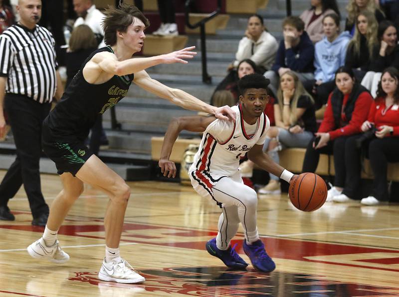 Huntley's Bryce Walker brings the ball up the court against Huntley's Ryan Sweeney during a Fox Valley Conference boys basketball game Tuesday, Feb.6, 2024, at Huntley High School.