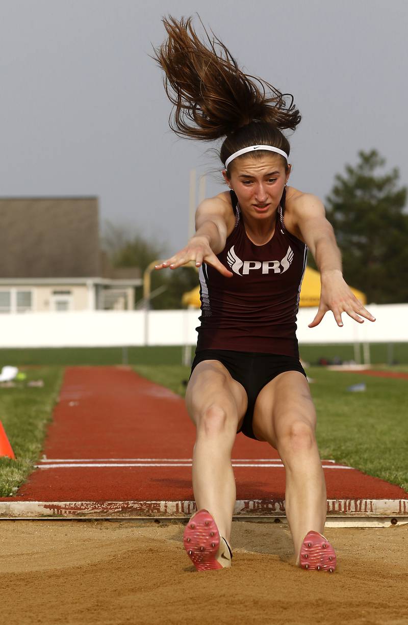 Prairie Ridge’s Rylee Lydon competes in the long jump during the IHSA Class 3A Huntley Girls Track Sectional Wednesday, May 11, 2022, at Huntley High School.