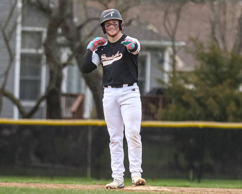 Sandwich's Jeffery Ashley (8) gestures to the dugout after pulling up at second for a double during baseball game between Sandwich at Plano on Thursday, April 9, 2025 in Plano.