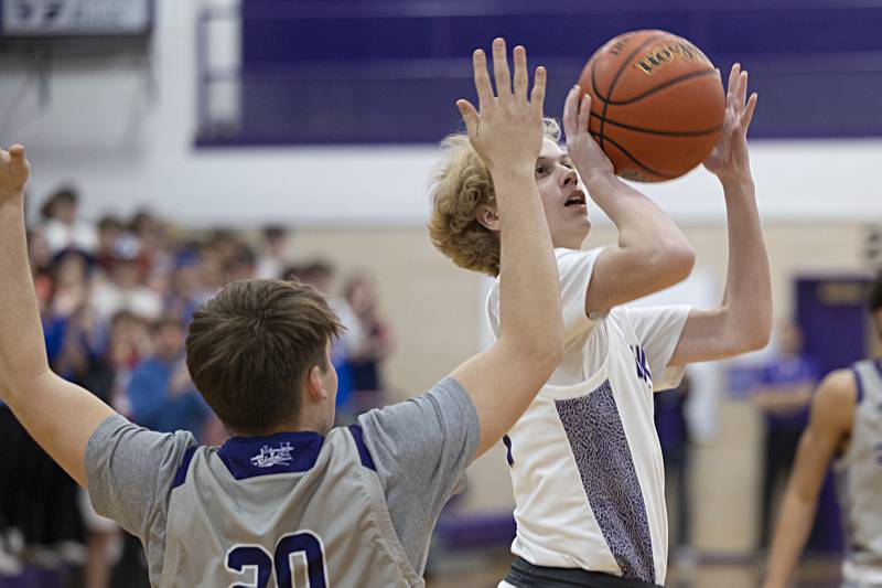 Dixon’s Jarrett McHugh puts a shot up against Plano Wednesday, Dec. 6, 2023 at Dixon High School.