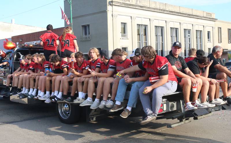 The Hall High School football team rides during the Homecoming parade on Thursday, Sept. 18, 2025 downtown Spring Valley.