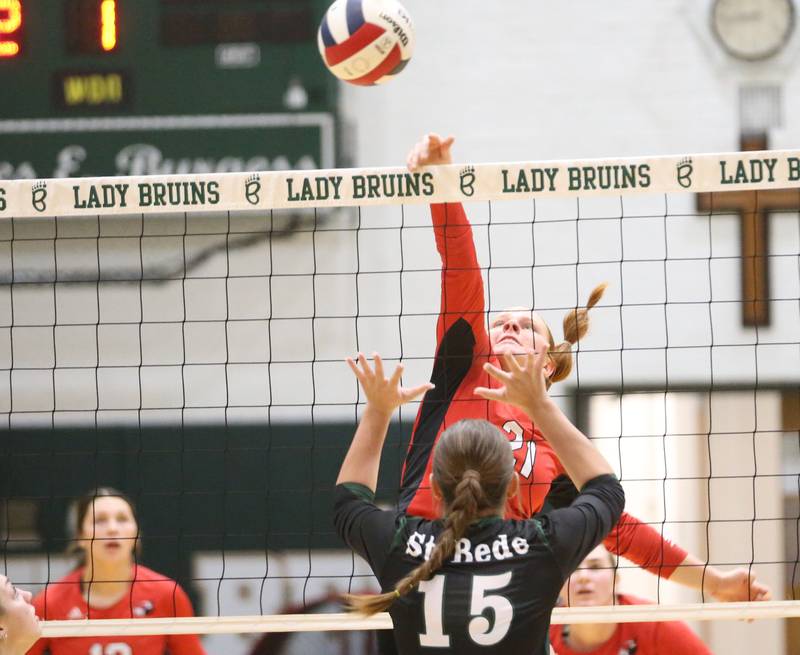 Henry's Brynna Anderson sends the ball past St. Bede's Jillian Pinter during the Class 1A Regional final game on Thursday, Oct. 31, 2024 at St. Bede Academy.