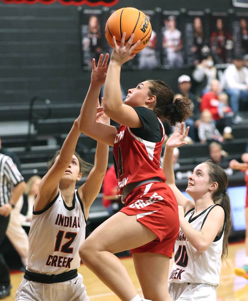 Aurora Christian’s Jada Yizkaya shoots between Indian Creek's Isabella Turner (left) and Ally Keilman during their game Monday, Nov. 25, 2024, at Indian Creek High School in Shabbona.