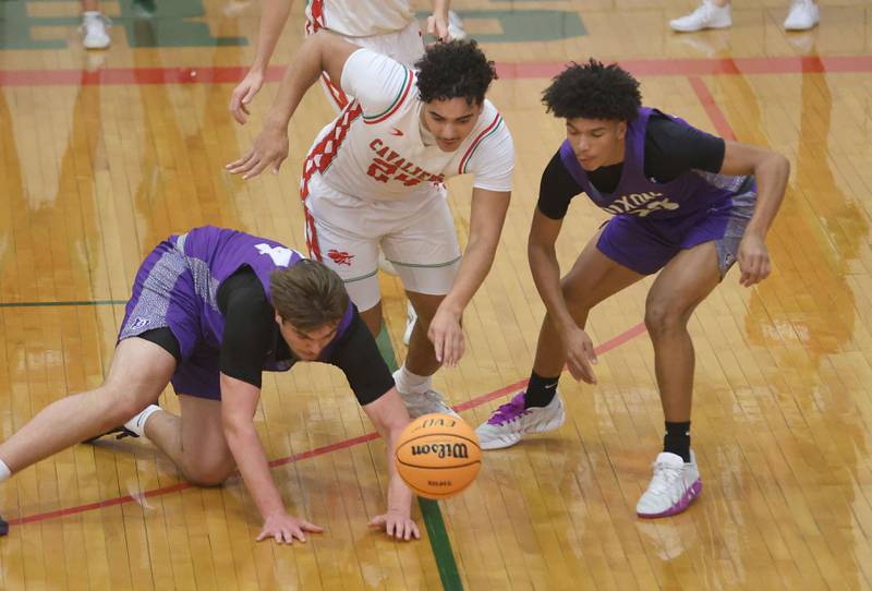 Dixon's Jakob Nicklaus looses control of the ball as L-P's Marion Persich sprints to the ball during the Class 3A Regional semifinal game on Wednesday, Feb. 25, 2026 in Sellett Gymnasium at L-P High School.