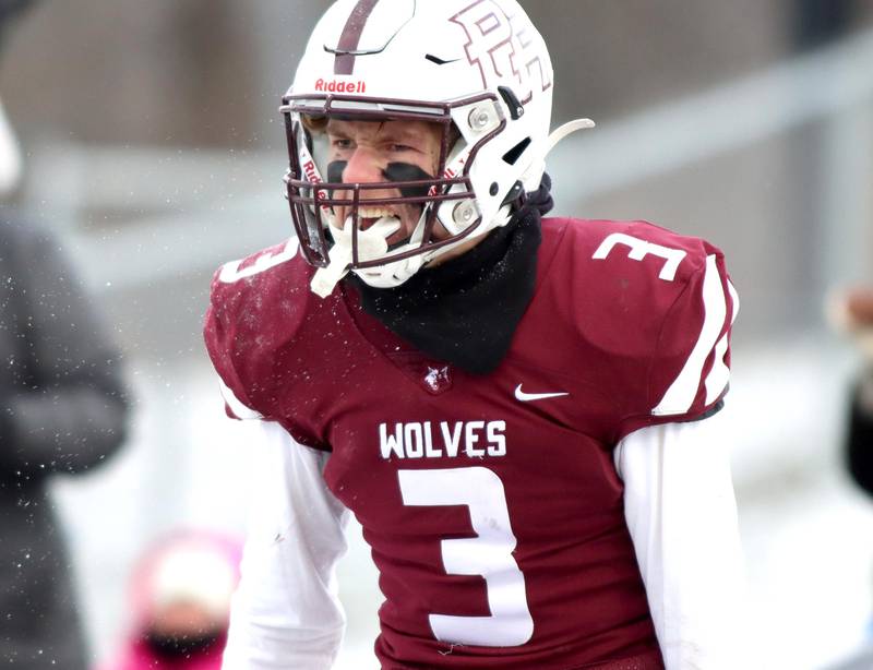 Prairie Ridge’s Drake Tomasiewicz howls with delight after receiving a touchdown pass against St. Ignatius in Class 6A football playoff semifinal action at Crystal Lake on Saturday.