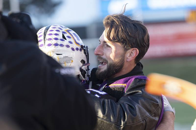 Chicago Christian head coach CJ Cesario is congratulated after his Knights beat Maroa-Forsyth 47-0 Friday, Nov. 29, 2024, in the class 2A football state final.