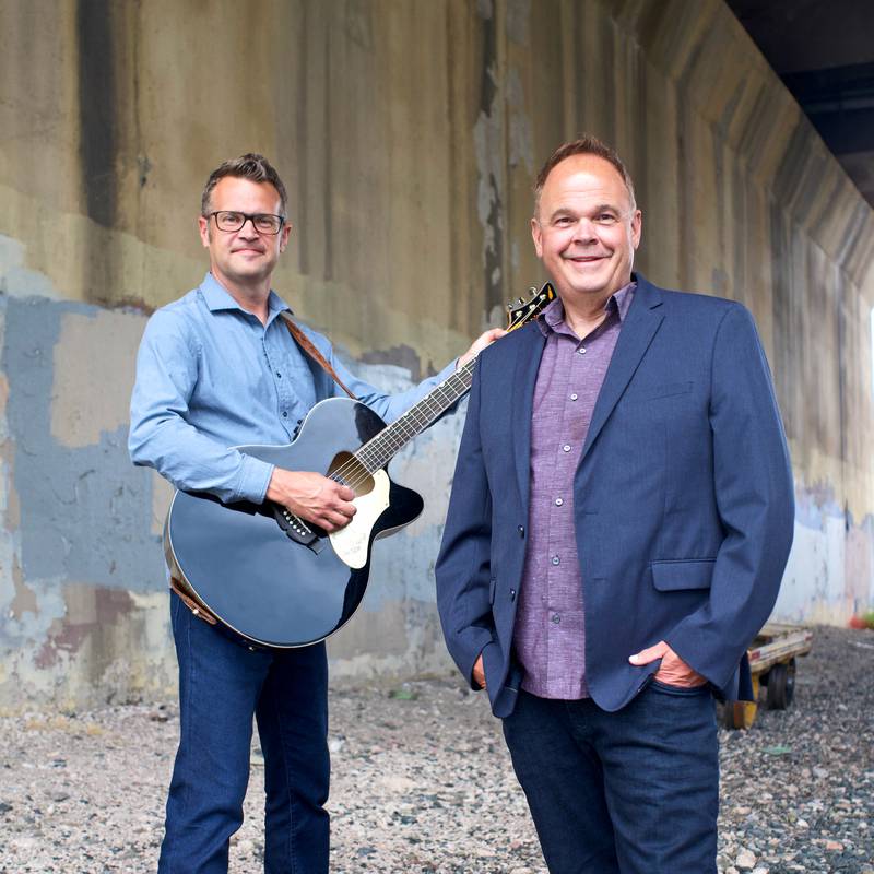 The Doug and Dave Show is a performance based on the premise of a fictitious radio station where attendees at the event become a fictitious studio audience. Pictured, from left, are the creators and performers Dave Wilson and Doug Brummel.