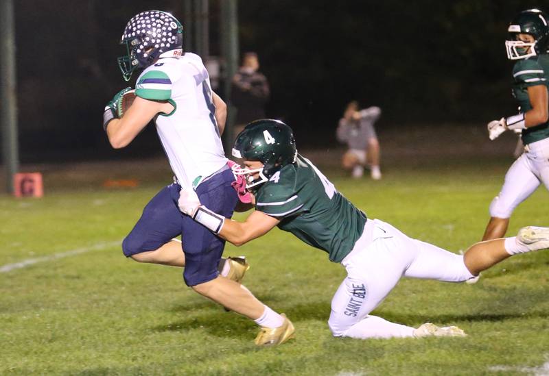 St. Bede's AJ Hermes tries to bring down Peoria Notre Dame's Dallas Harder on a run on Friday, Oct. 17, 2025 at St. Bede Academy.